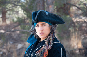 Staci dressed in Steam Punk looking at camera